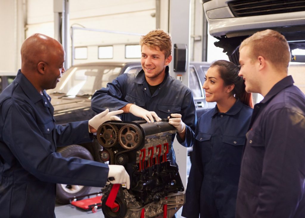 Youth in the Canadian auto industry learning from their teacher.