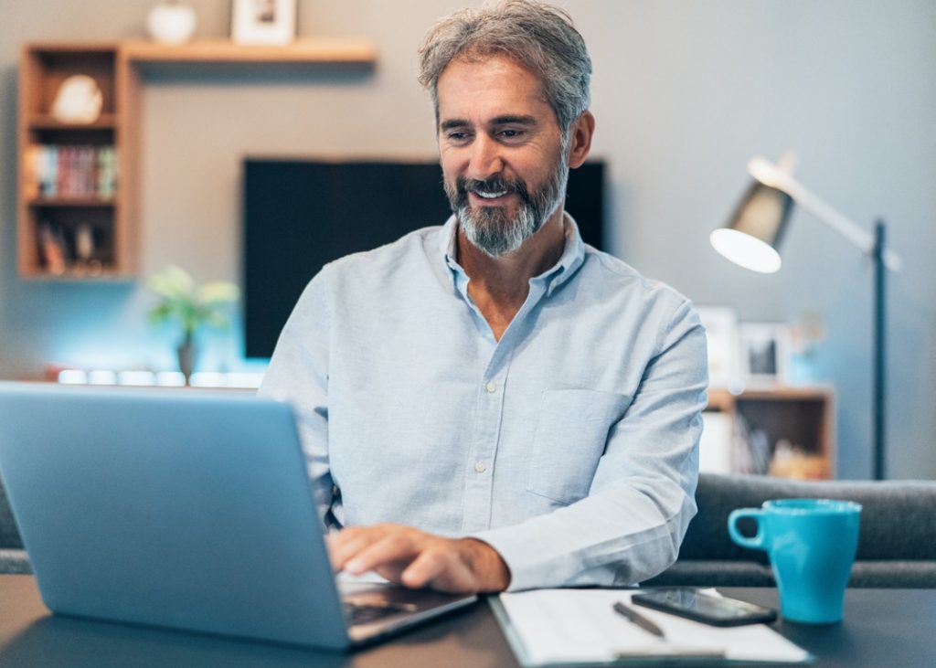 Man attending a webinar from home