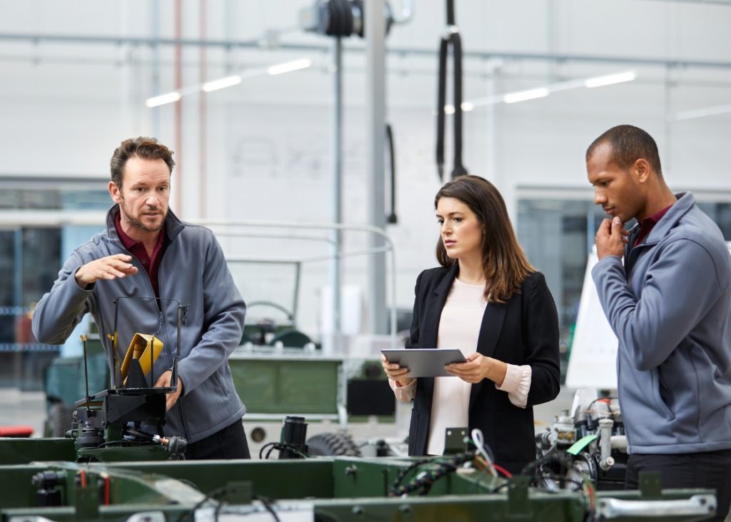 Group of automotive employees working together