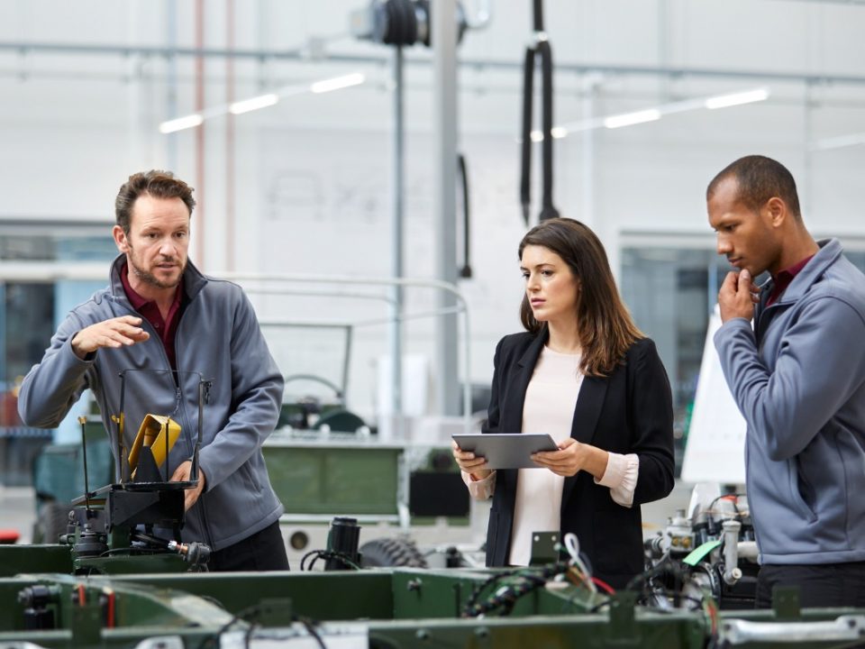 Group of automotive employees working together